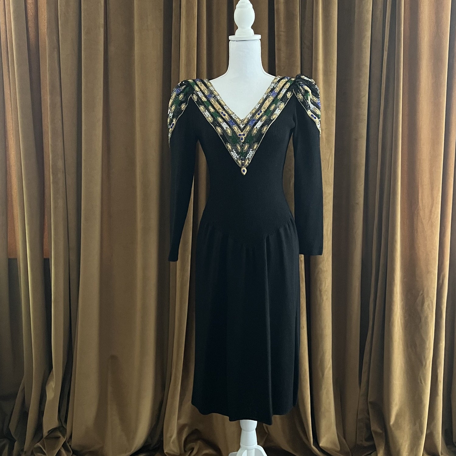Black sweater dress with gold and blue sequins